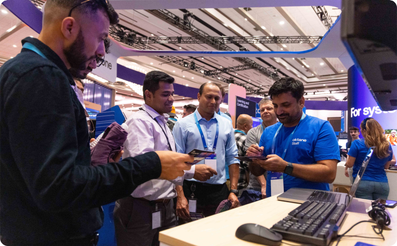 Oktane Staff Member Assisting Attendees at Demo Station